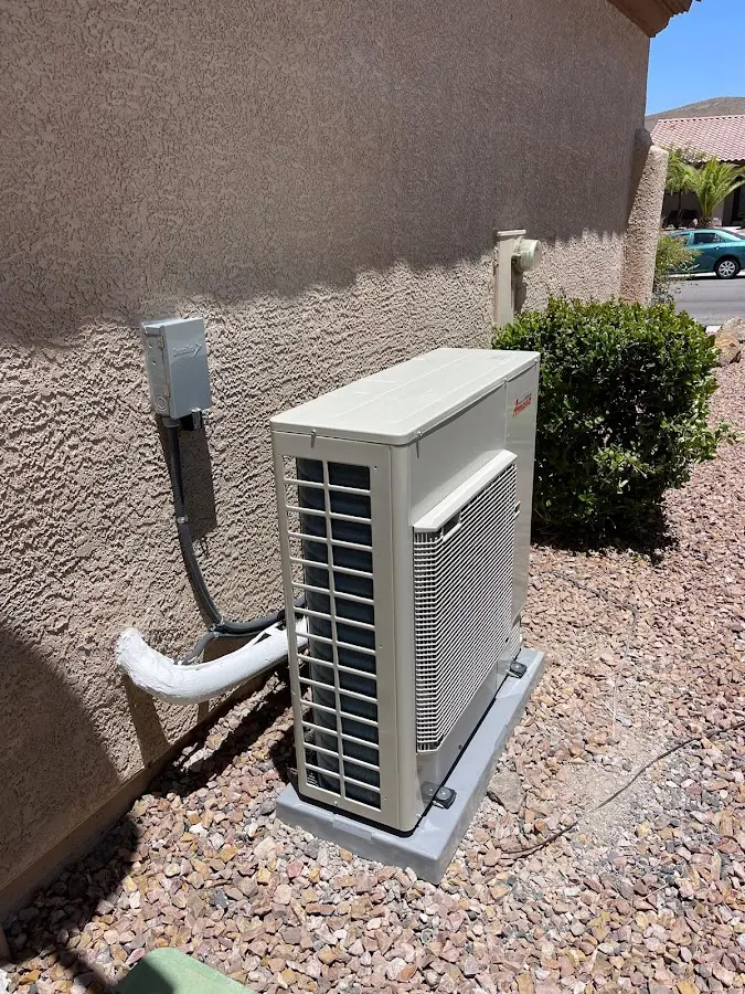 Residential air conditioning condenser unit in Holladay